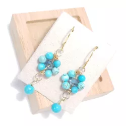 boucles d'oreilles pendantes Alysson turquoises et acier inoxydable doré forme fleurs