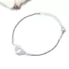 le bracelet "Patoche" en fil de cuir noir et menotte,  en acier inoxydable argenté