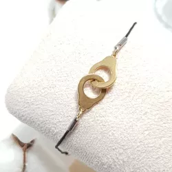 bracelet "Patoche" en fil de cuir noir et menotte, en acier inoxydable doré