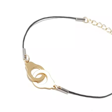 bracelet "Patoche" en fil de cuir noir et menotte, en acier inoxydable doré