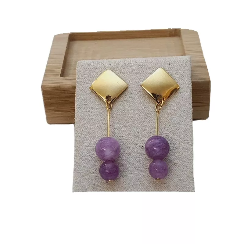 Boucles d’oreilles Mélia en acier inoxydable doré avec perle de calcédoine Boucles d’oreilles Mélia en acier inoxydable doré avec perle de calcédoine