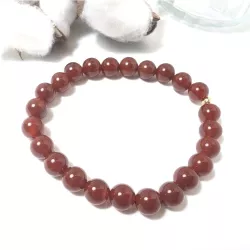 Bracelet en cornaline 8mm et perle acier doré