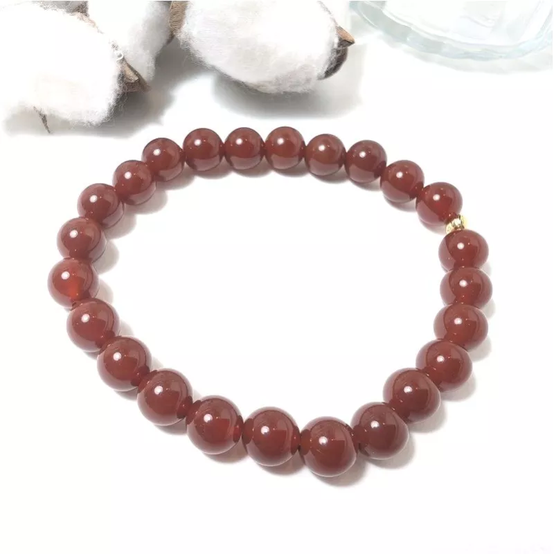 Bracelet en cornaline 8mm et perle acier doré Bracelet en cornaline 8mm et perle acier doré