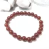 Bracelet en cornaline 8mm et perle acier doré