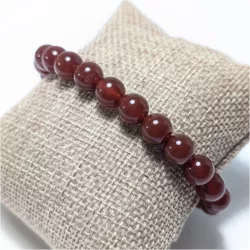 Bracelet en cornaline 8mm et perle acier doré