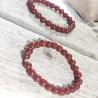Bracelet en cornaline 8mm et perle acier doré