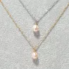 Collier pendentif Centauri avec perle rosée, acier doré et argenté