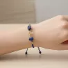Bracelet fil Eta – Lapis Lazuli – acier inoxydable doré – vue portée