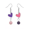 boucles passion avec un coeur et pierre naturelle, acier inoxydable argenté, rose violet sur fond blanc