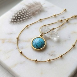 Collier Séléné en acier inoxydable doré et turquoise avec décor de plume et cristal